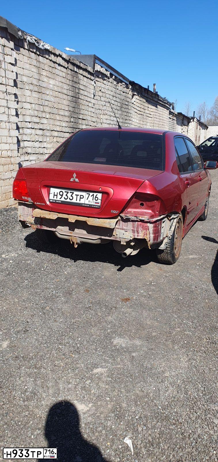 Фото автомобиля MITSUBISHI LANCER, 2005 — госномер Н933ТР716. Цвет: Красный