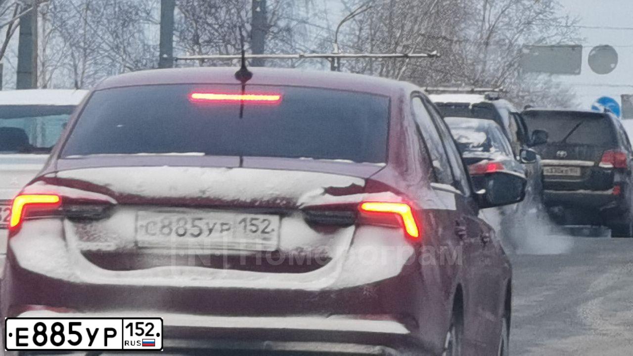 Фото автомобиля SUBARU OUTBACK, 2011 — госномер Е885УР152. Цвет: Красный