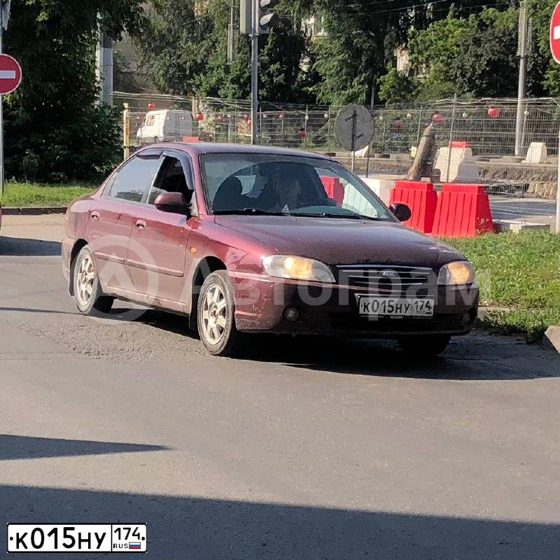 Фото автомобиля KIA SPECTRA, 2011 — госномер К015НУ174. Цвет: КРАСНЫЙ ПЕРЕЦ