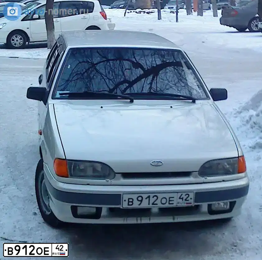 Фото автомобиля LADA 2114 SAMARA, 2005 — госномер В912ОЕ42. Цвет: МОЛОЧНО-БЕЛЫЙ СЕРЕБРИСТЫЙ
