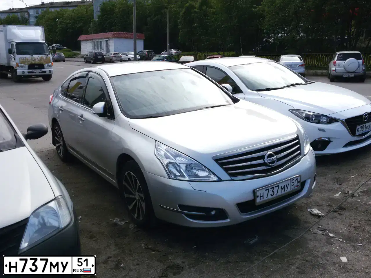 Фото автомобиля NISSAN TEANA, 2012 — госномер В516НО51. Цвет: Серебристый