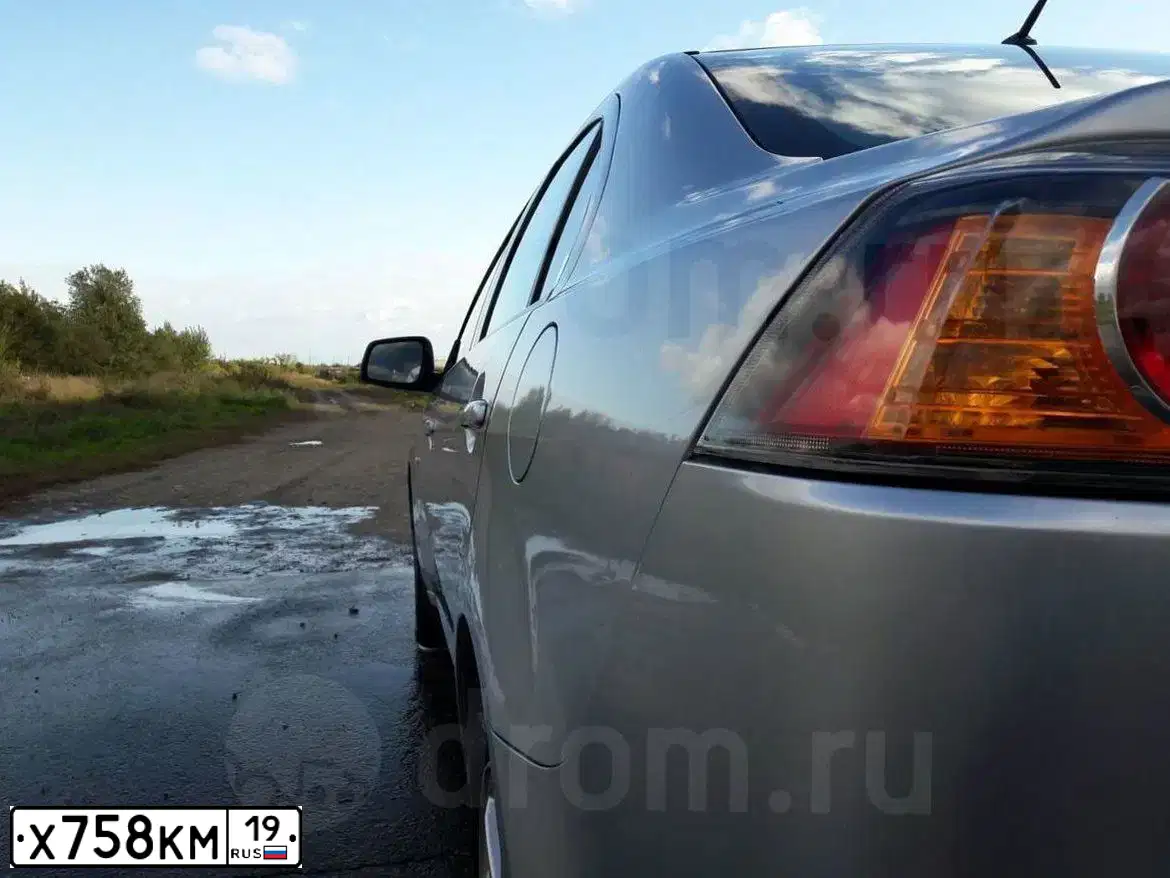 Фото автомобиля MITSUBISHI LANCER, 2012 — госномер Х758КМ19. Цвет: СЕРЕБРИСТЫЙ