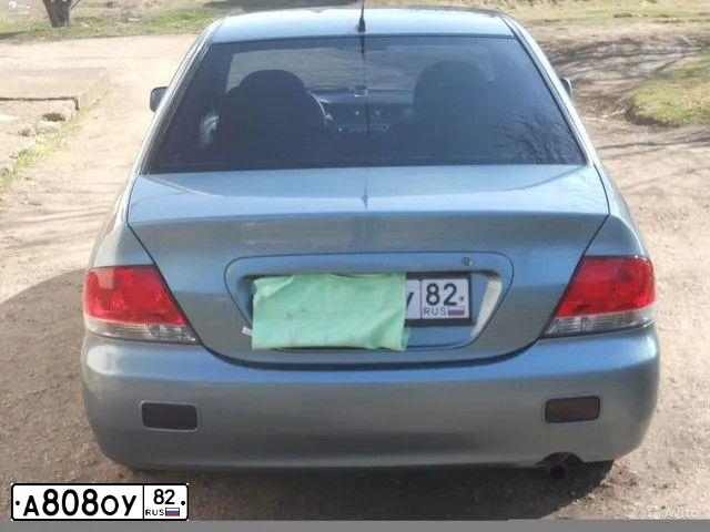 Фото автомобиля MITSUBISHI LANCER, 2006 — госномер Н391РН82. Цвет: СЕРО-ЗЕЛЕНЫЙ