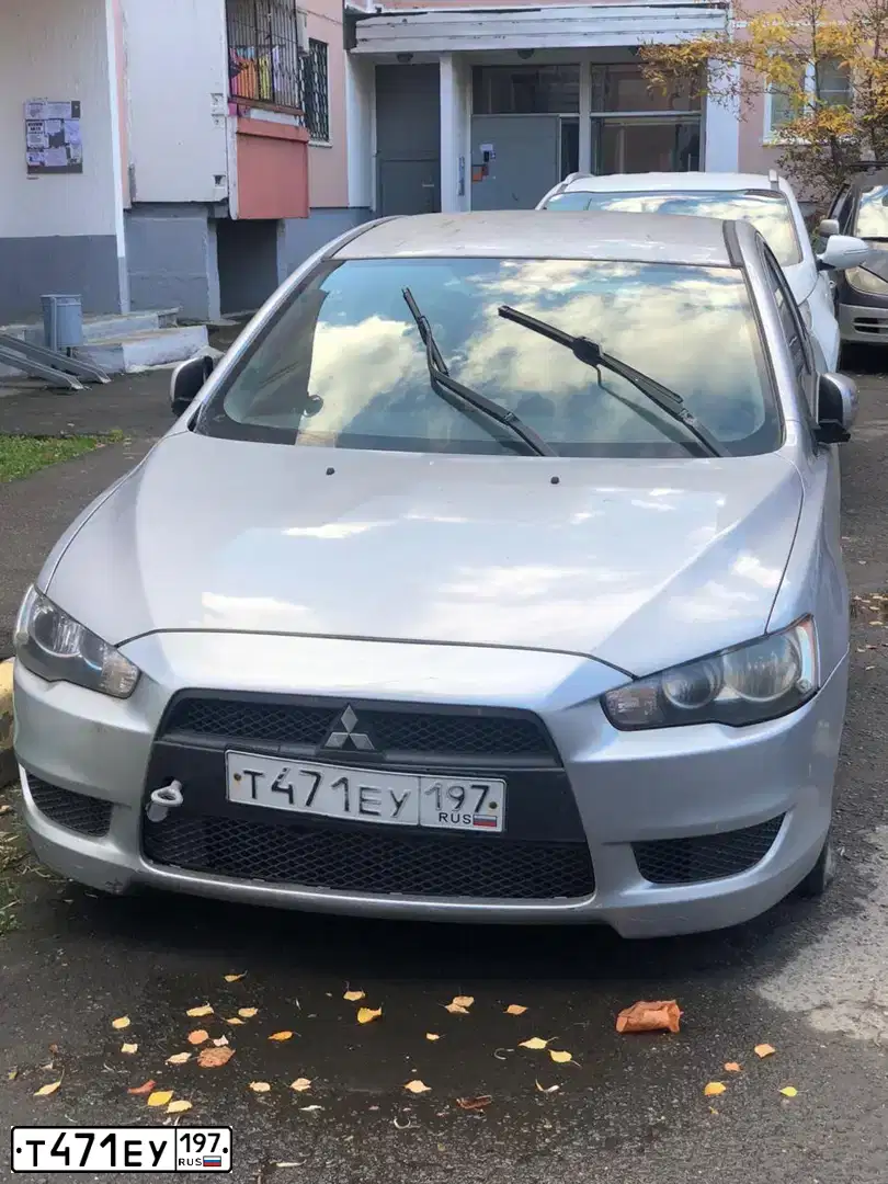 Фото автомобиля MITSUBISHI LANCER, 2007 — госномер Р062КМ977. Цвет: СЕРЕБРИСТЫЙ