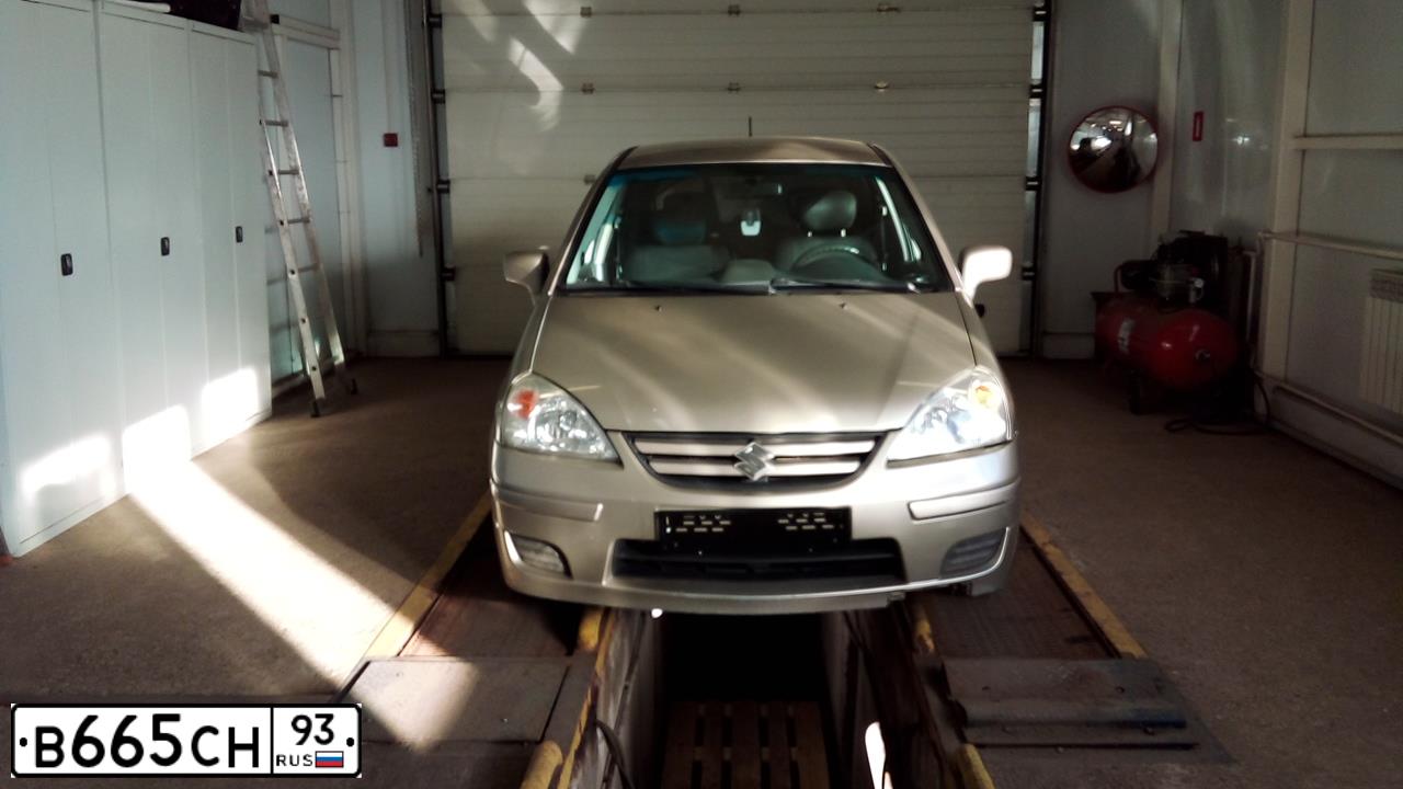 Фото автомобиля SUZUKI LIANA, 2006 — госномер Т410МР76. Цвет: СЕРЫЙ