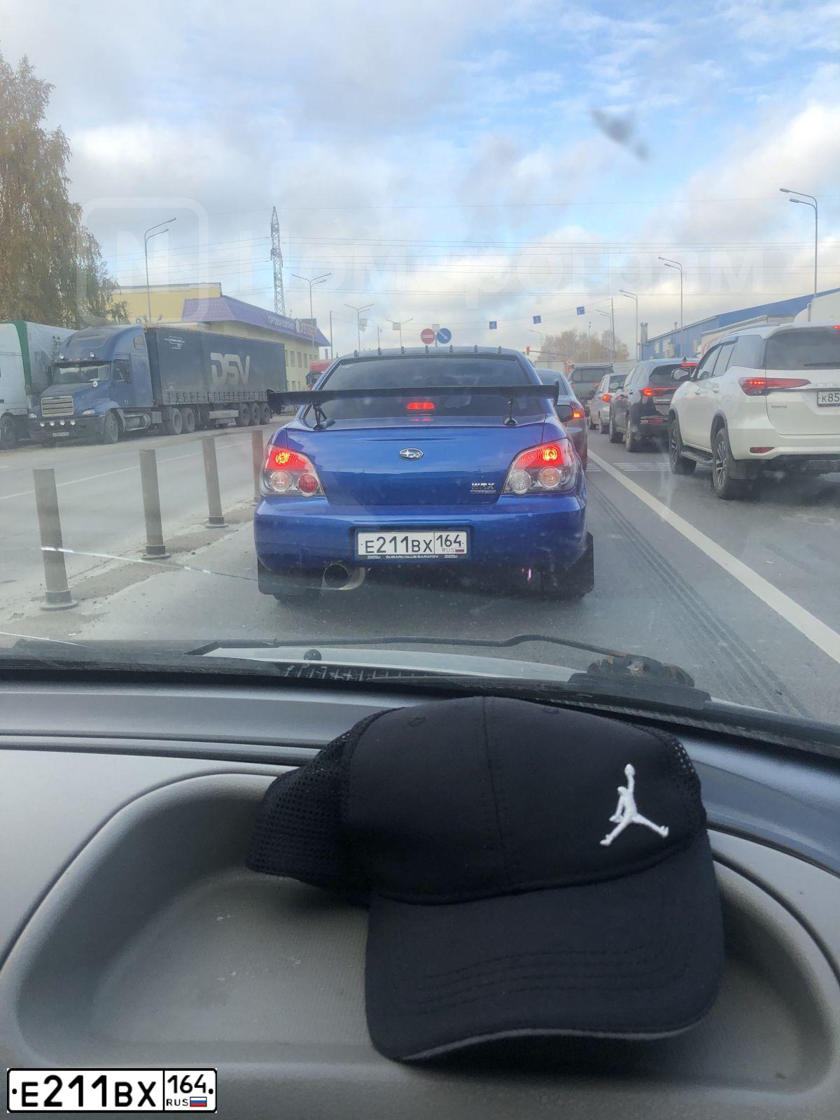 Фото автомобиля SUBARU IMPREZA, 2006 — госномер Е211ВХ164. Цвет: синий