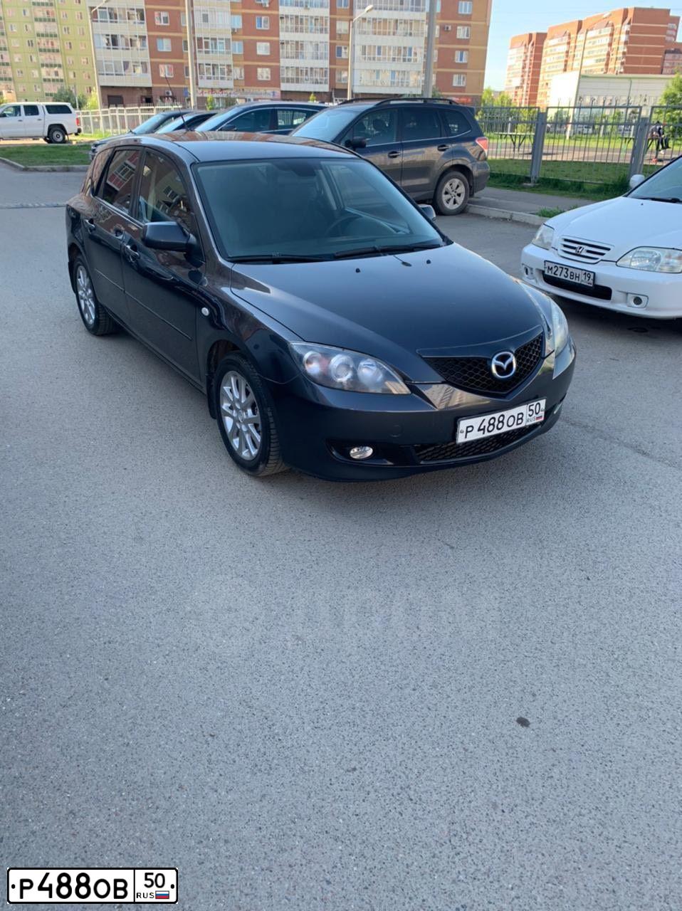 Фото автомобиля MAZDA 3, 2007 — госномер Т606СМ124. Цвет: СЕРЫЙ ТЕМНЫЙ