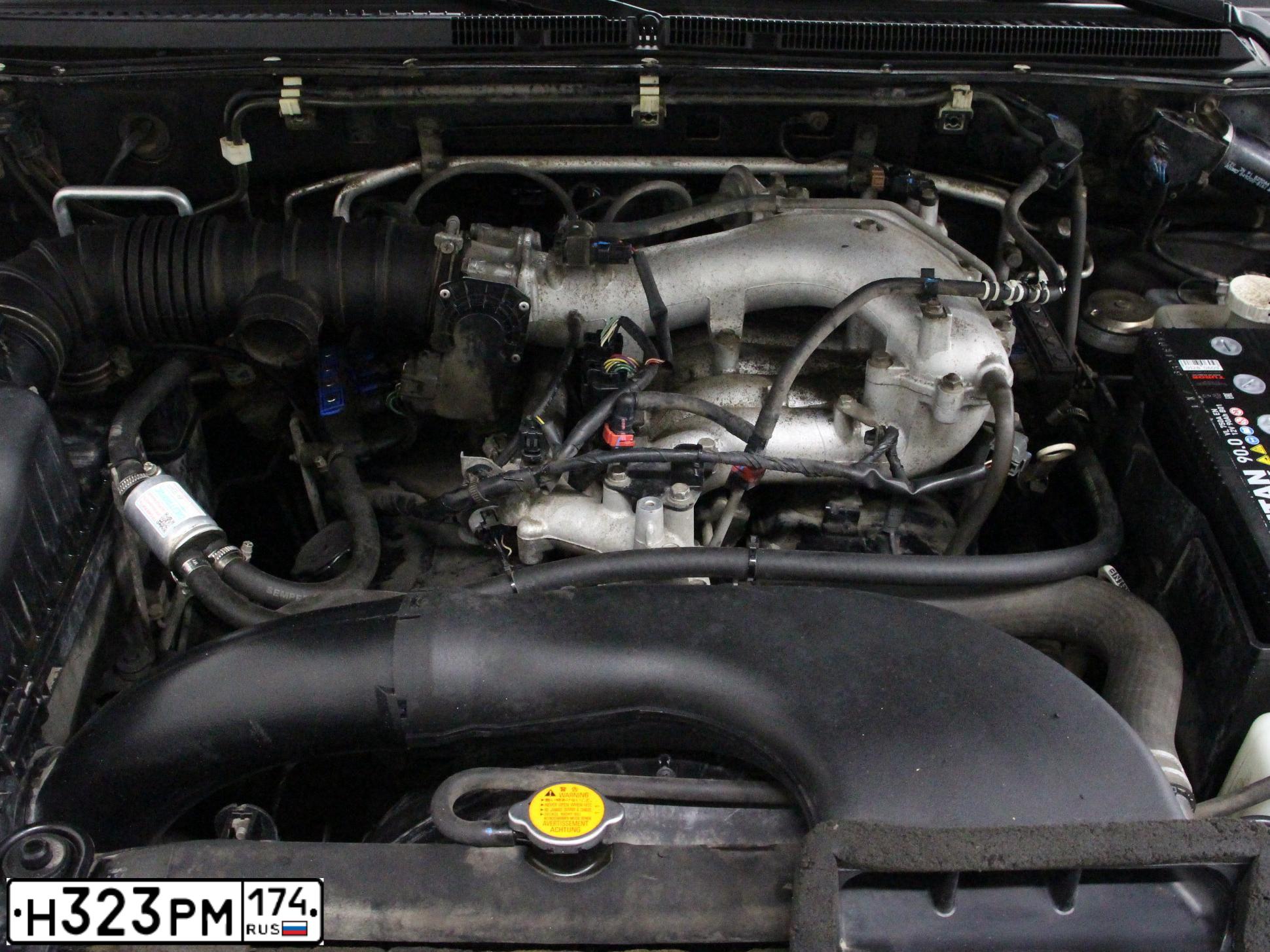 Фото автомобиля MITSUBISHI PAJERO, 2011 — госномер Н323РМ174. Цвет: ЧЕРНЫЙ