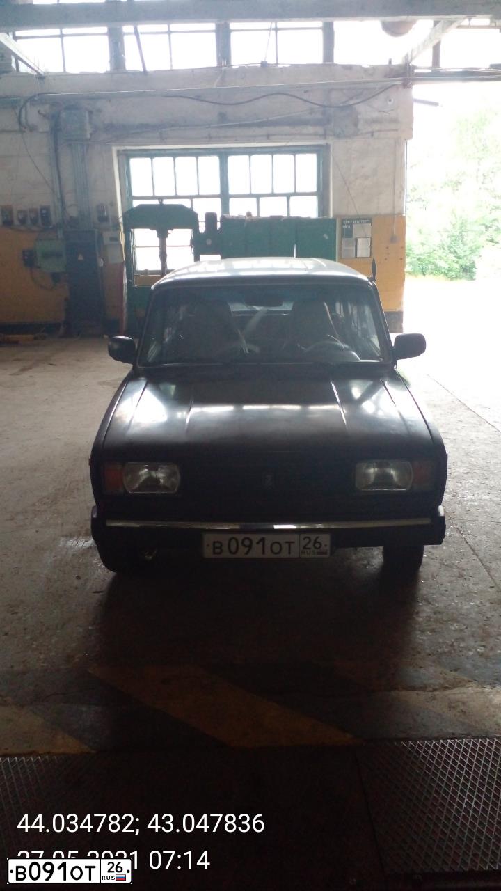 Фото автомобиля LADA 2104 LADA, 2005 — госномер В091ОТ26. Цвет: КОРИЧНЕВЫЙ БАКЛАЖАН