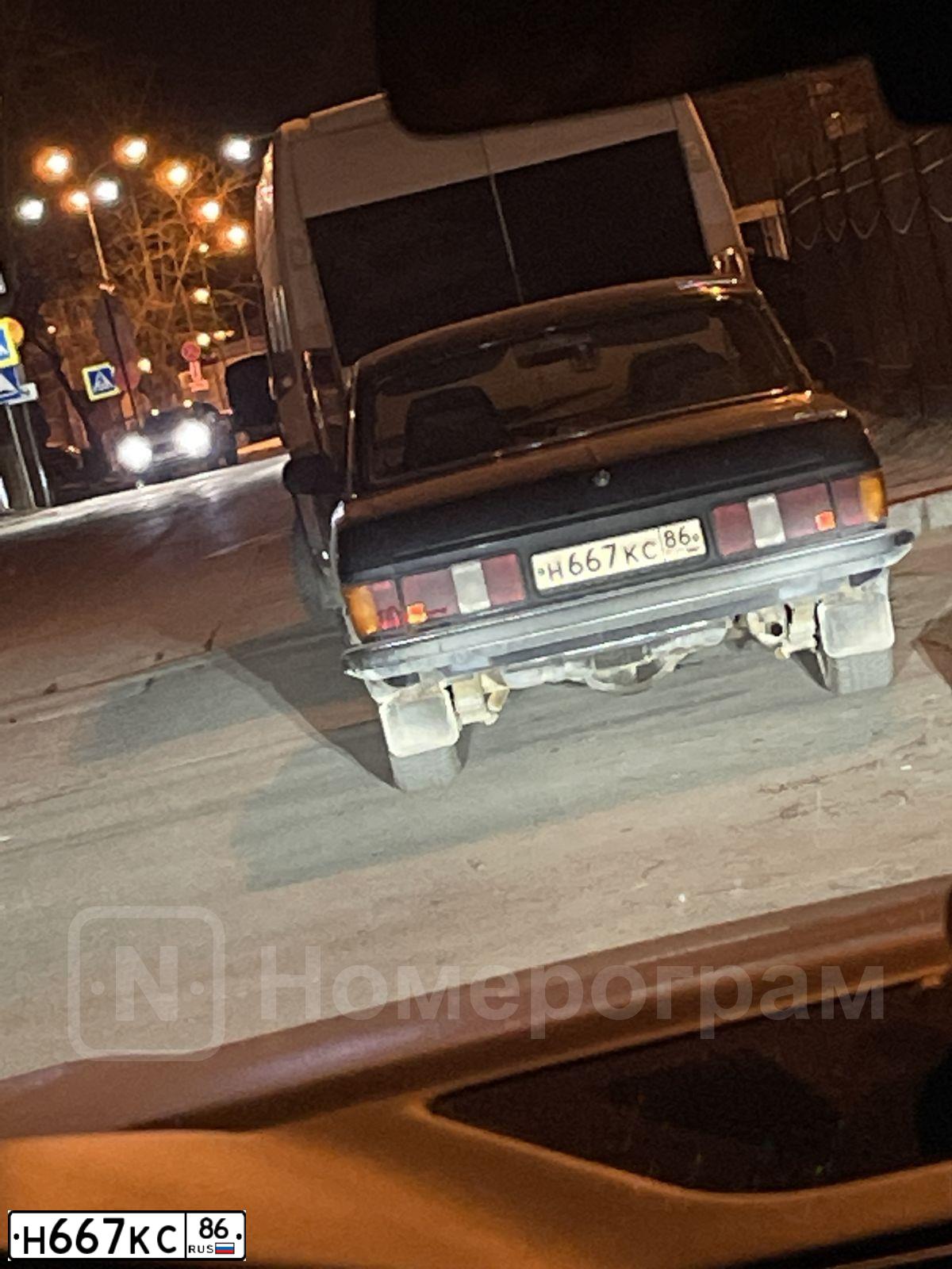 Фото автомобиля GAZ 3102 WOLGA, 2001 — госномер Н667КС86. Цвет: ЧЕРНЫЙ