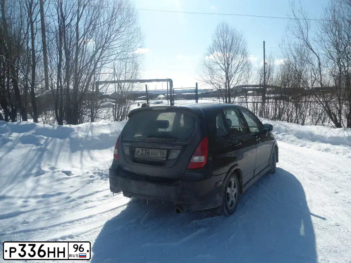 Фото автомобиля SUZUKI AERIO, 2003 — госномер К446АХ156. Цвет: ЧЕРНЫЙ