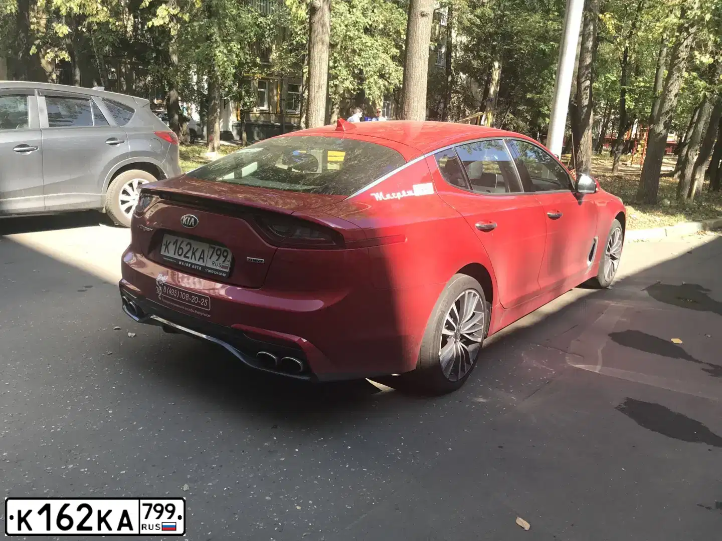 Фото автомобиля KIA STINGER, 2018 — госномер Т062РХ799. Цвет: Красный