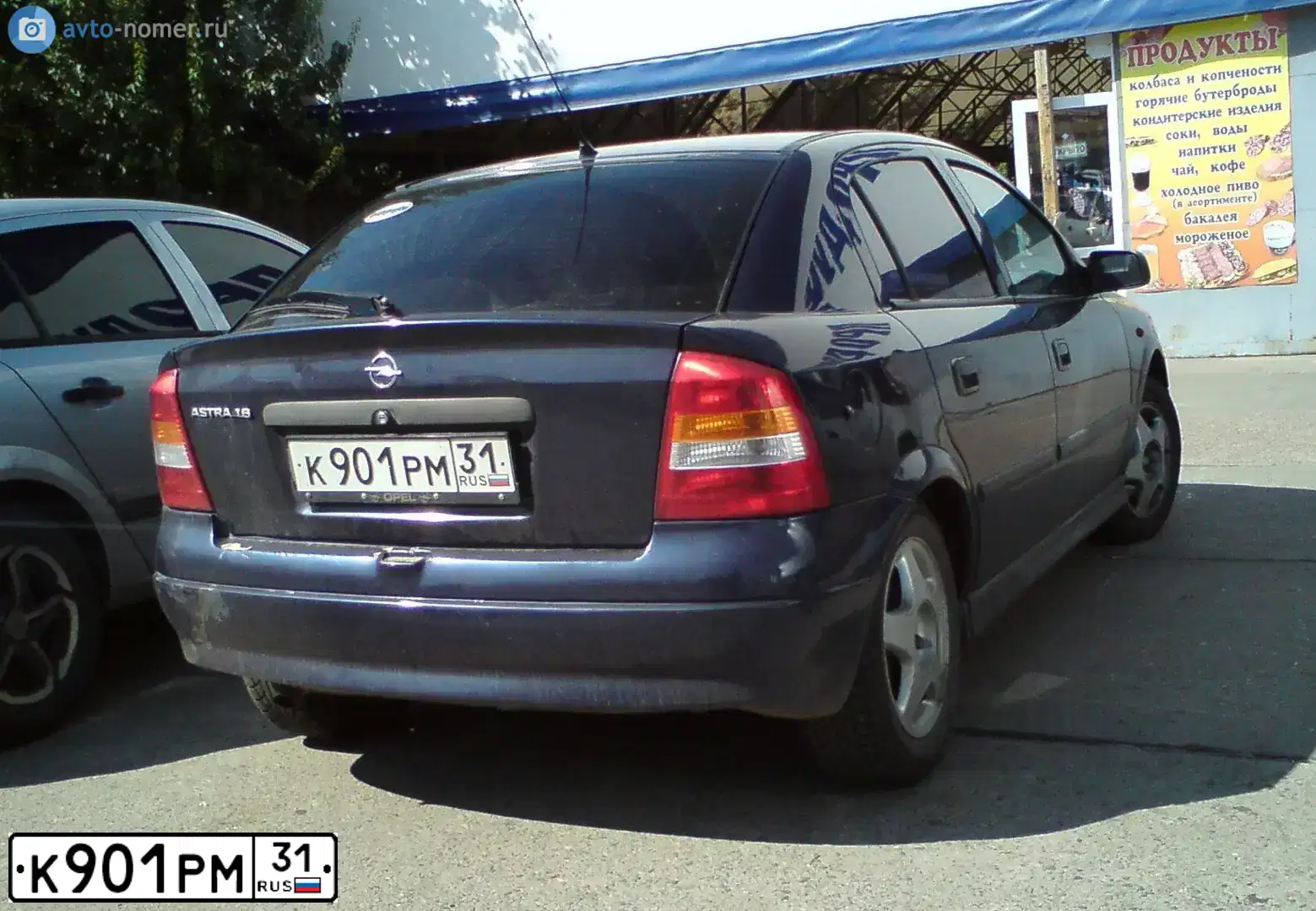 Фото автомобиля OPEL ASTRA, 1998 — госномер К901РМ31. Цвет: СИНИЙ