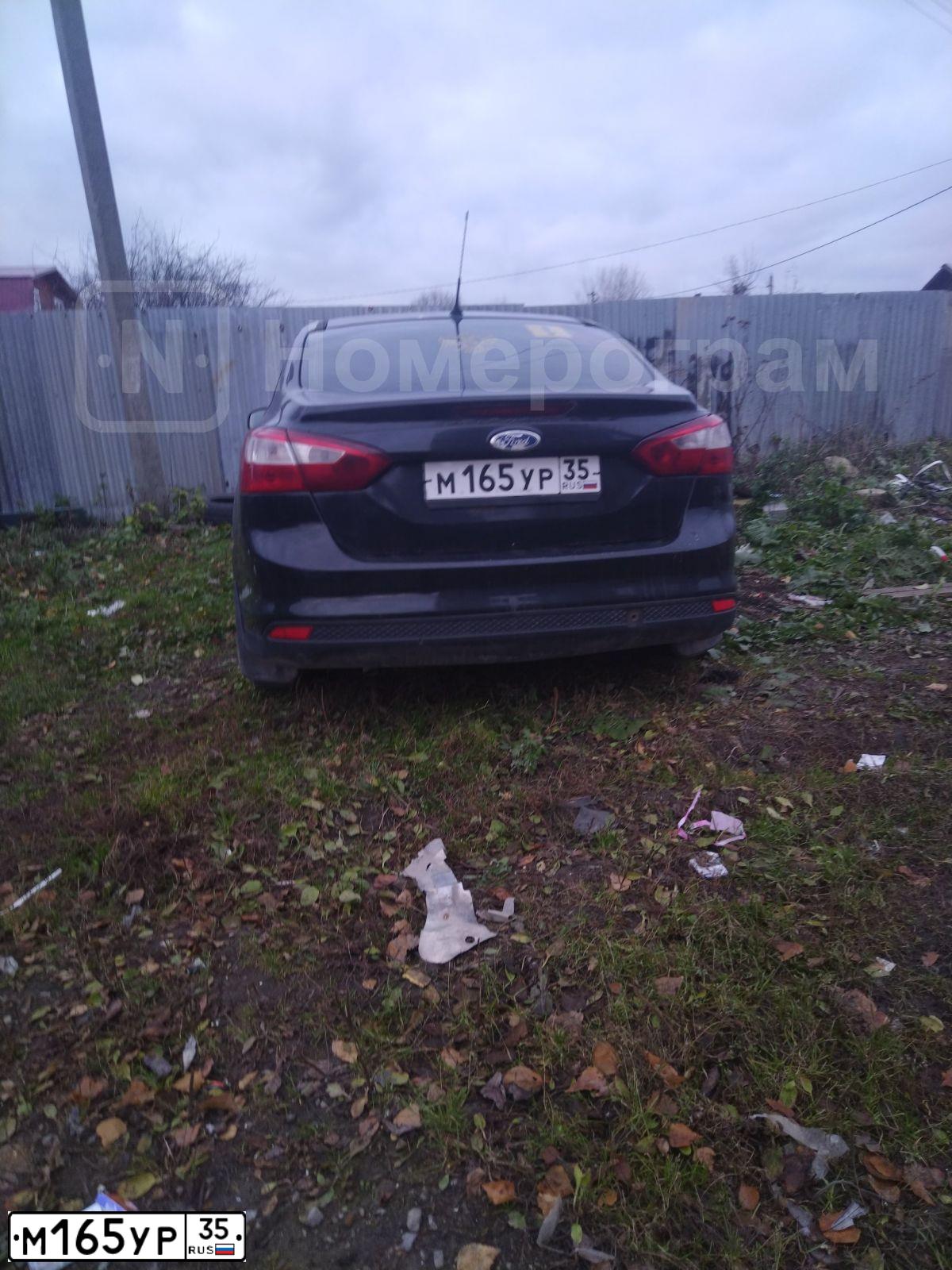 Фото автомобиля FORD FOCUS, 2012 — госномер М165УР35. Цвет: ЧЕРНЫЙ