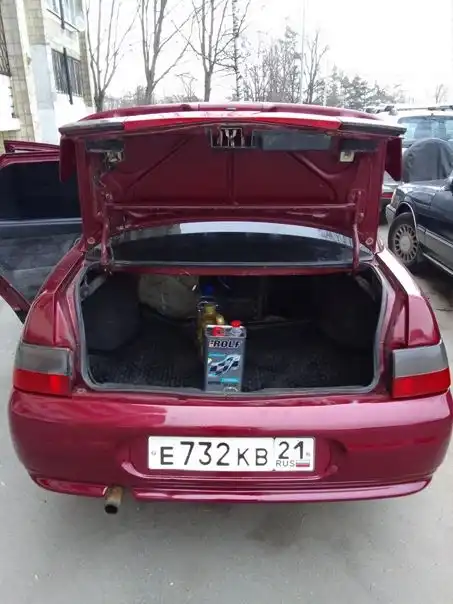 Фото автомобиля LADA 2110 LADA, 2005 — госномер К617НС138. Цвет: ТЕМНО-МАЛИНОВЫЙ