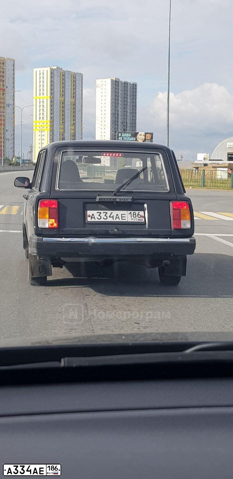 Фото автомобиля LADA 2104, 2012 — госномер А334АЕ186. Цвет: ЧЕРНЫЙ ЖЕМЧУГ