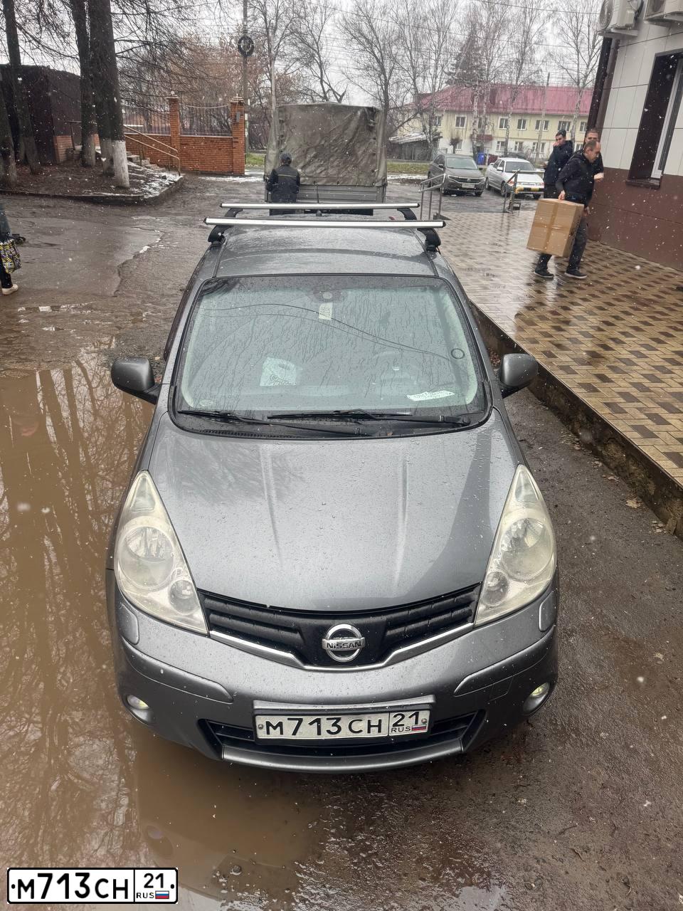 Фото автомобиля NISSAN NOTE, 2011 — госномер М713СН21. Цвет: Серый