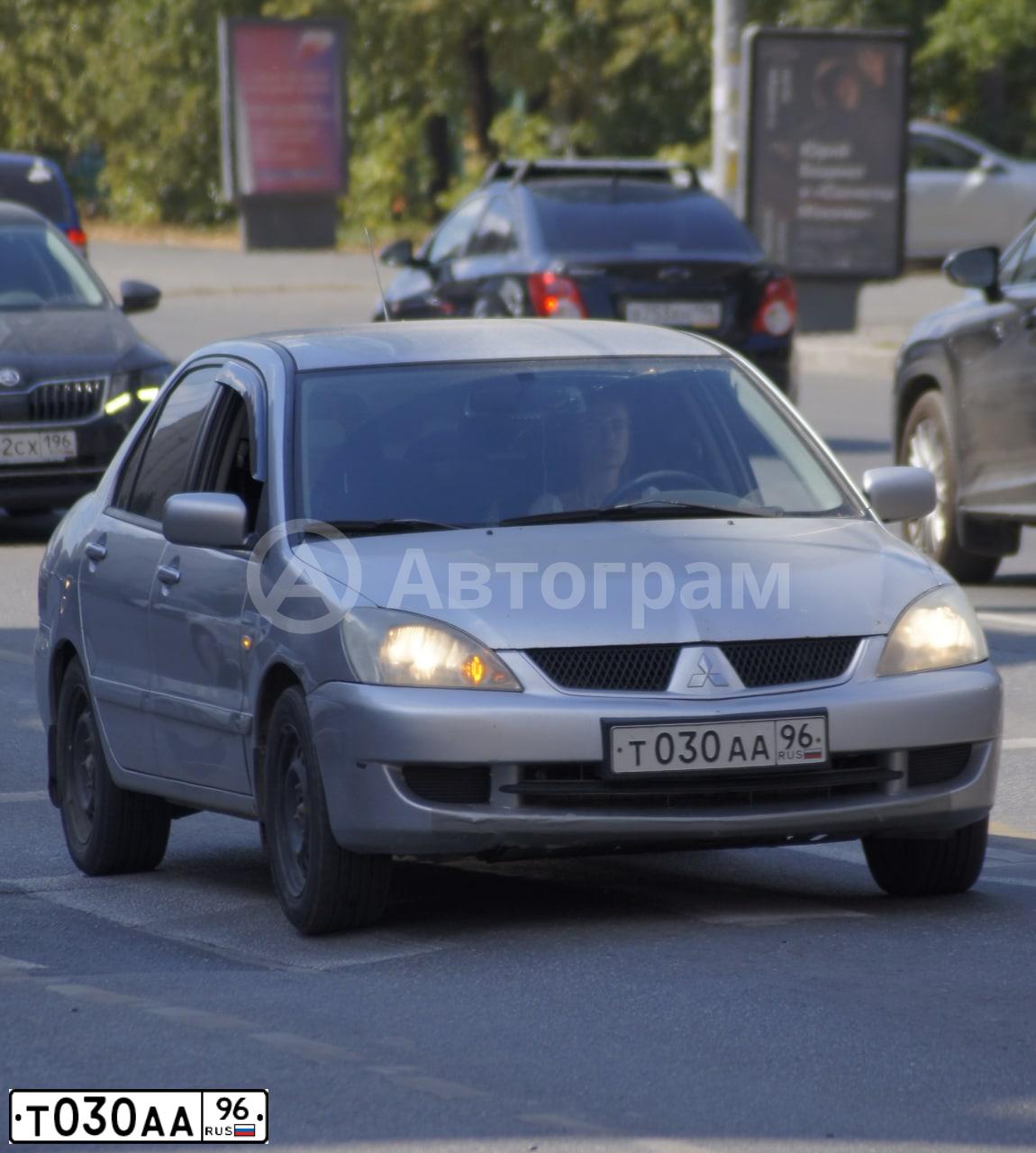 Фото автомобиля MITSUBISHI LANCER, 2007 — госномер Т030АА96. Цвет: СВЕТЛО-СЕРЫЙ