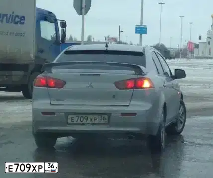 Фото автомобиля MITSUBISHI LANCER, 2007 — госномер Т222СС36. Цвет: СЕРЕБРИСТЫЙ