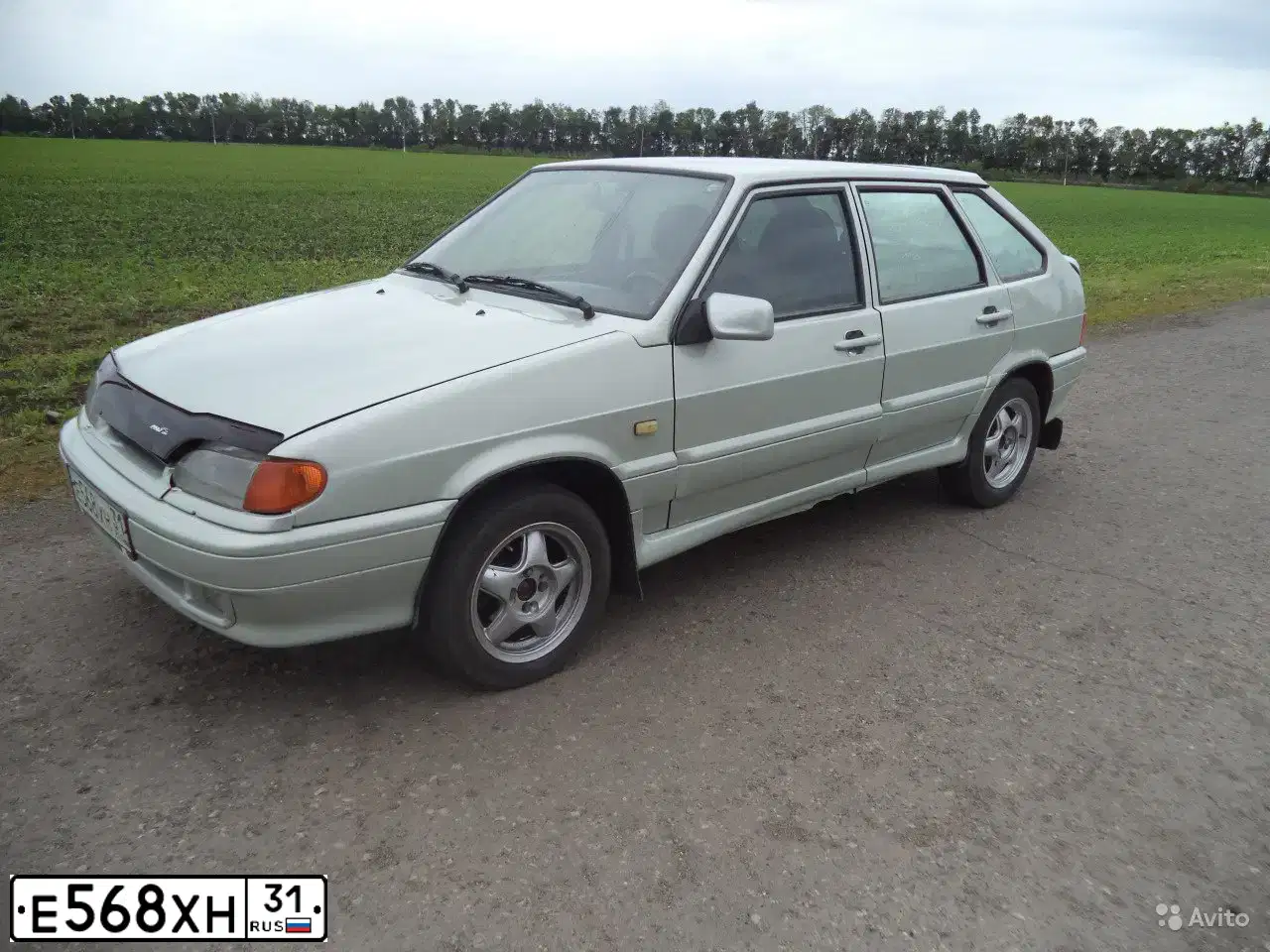 Фото автомобиля LADA 2114 SAMARA, 2006 — госномер О141ОА31. Цвет: МОЛОЧНО-БЕЛЫЙ СЕРЕБРИСТЫЙ