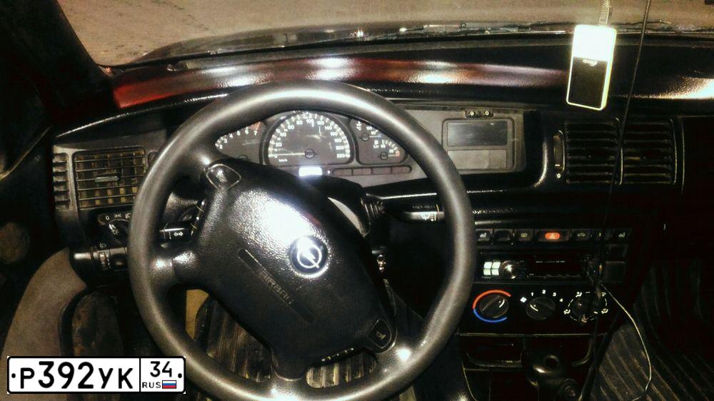 Фото автомобиля OPEL VECTRA, 1998 — госномер В569ВР702. Цвет: ЧЕРНЫЙ