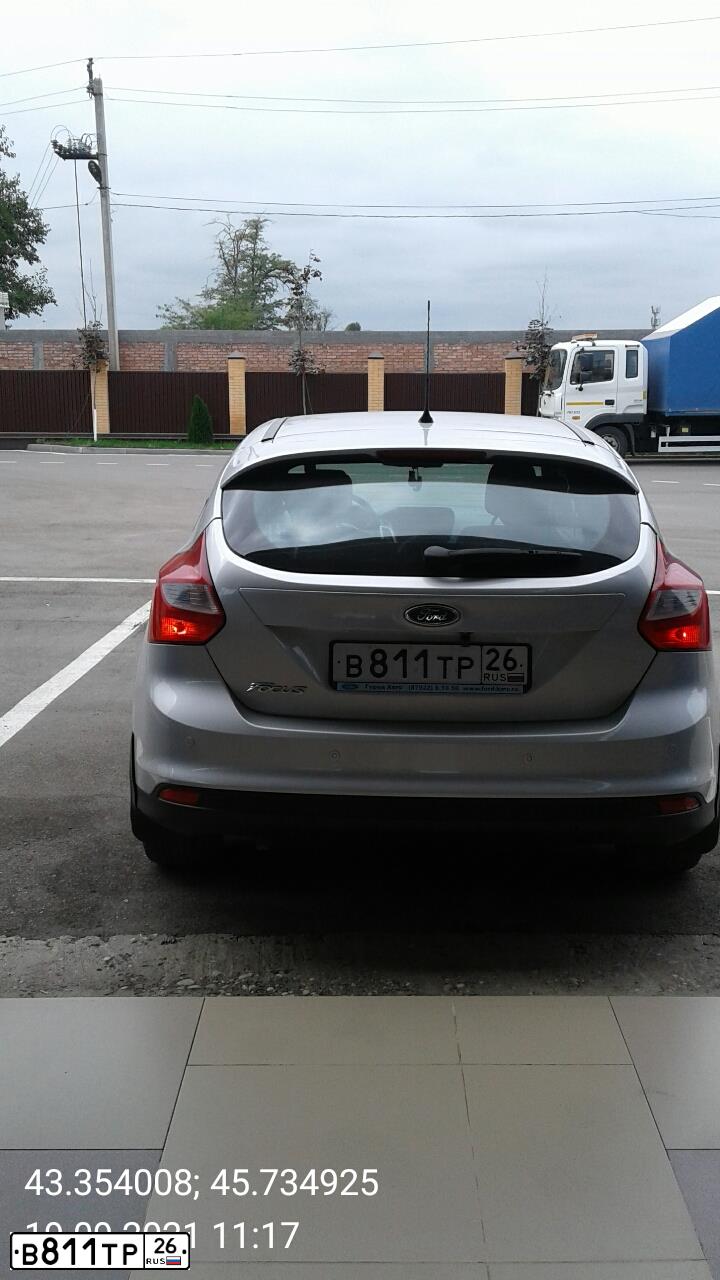 Фото автомобиля FORD FOCUS, 2011 — госномер Т714КК07. Цвет: Серебристый