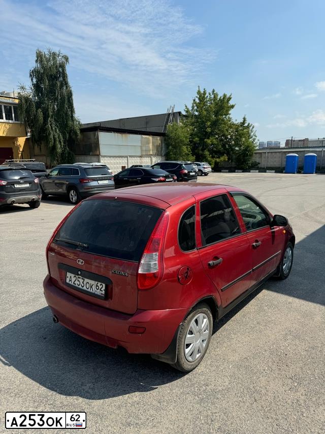 Фото автомобиля LADA 1119 KALINA, 2008 — госномер А253ОК62. Цвет: СЕРЕБРИСТО-КРАСНЫЙ
