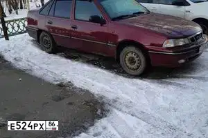 Фото автомобиля DAEWOO NEXIA, 2007 — госномер М852МХ196. Цвет: ВИШНЕВЫЙ