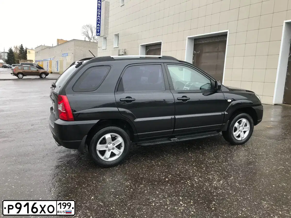 Фото автомобиля KIA SPORTAGE, 2010 — госномер М909АХ68. Цвет: ЧЕРНЫЙ ПЕРЛАМУТР