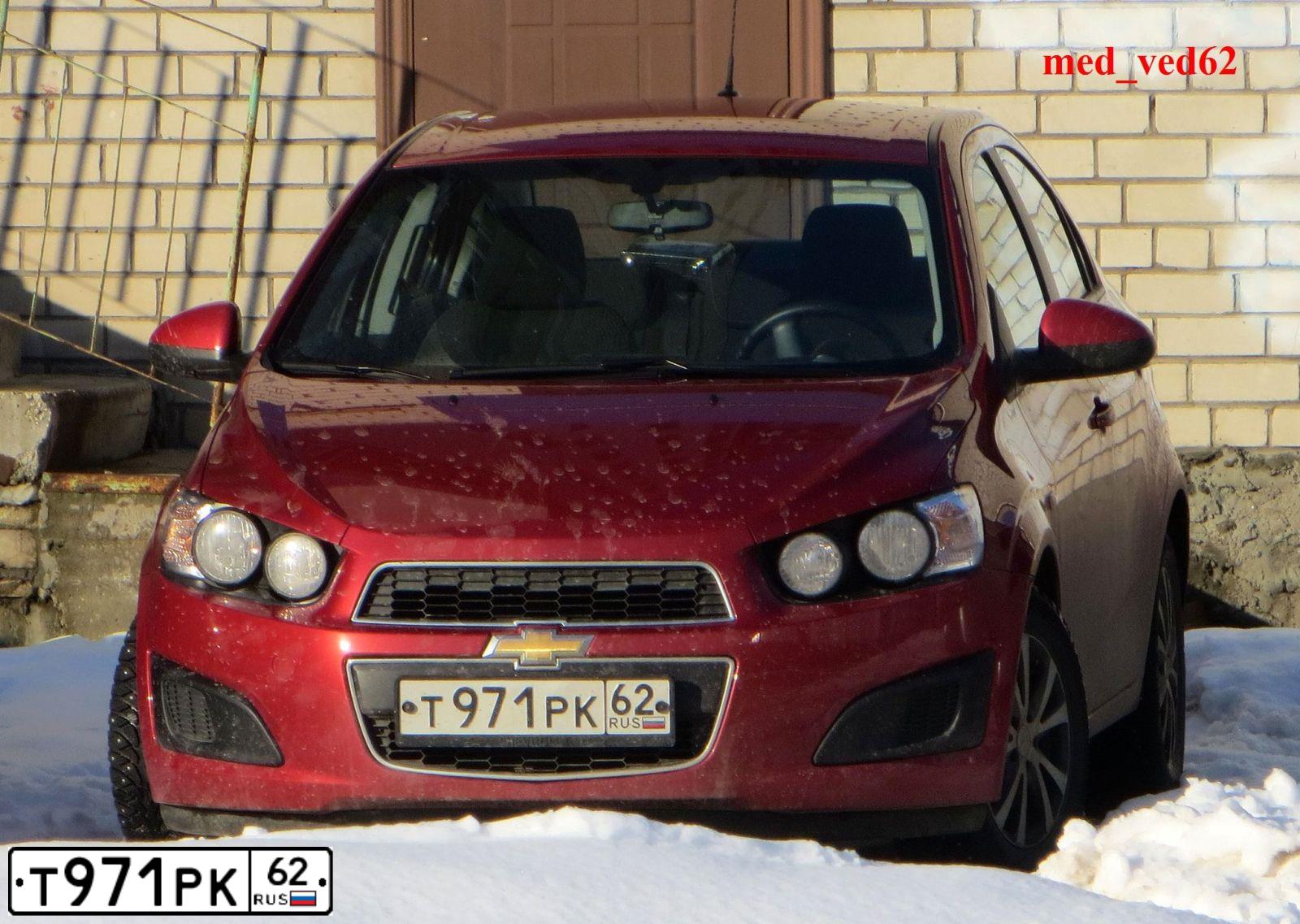 Фото автомобиля CHEVROLET AVEO, 2012 — госномер Т971РК62. Цвет: КРАСНЫЙ
