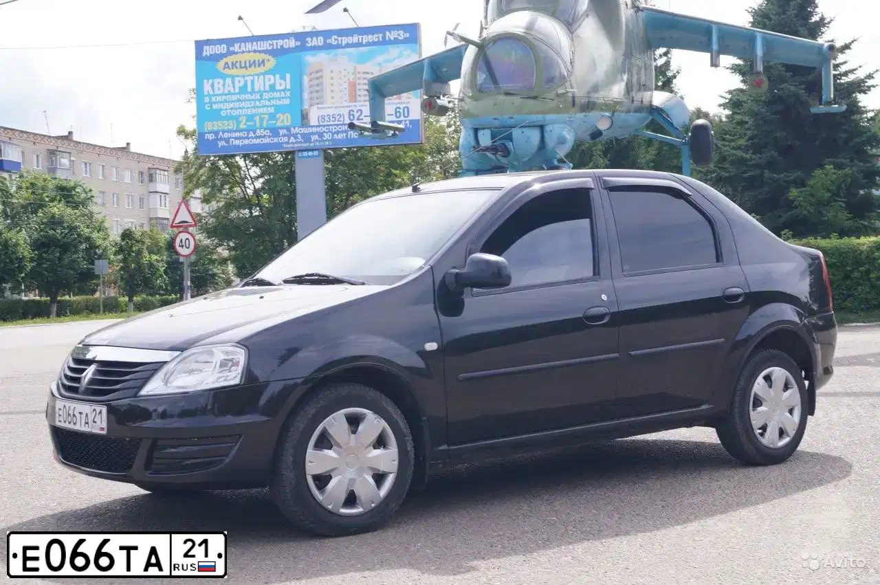 Фото автомобиля RENAULT LOGAN, 2011 — госномер Е066ТА21. Цвет: ЧЕРНЫЙ