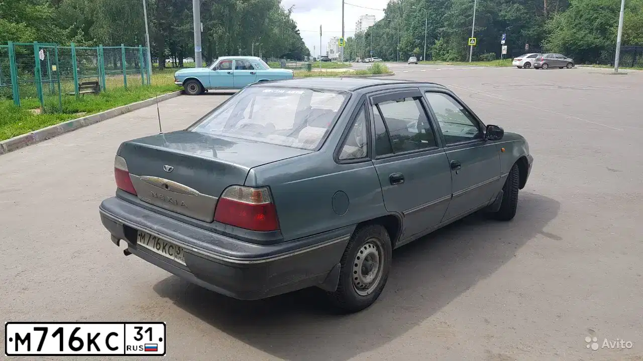 Фото автомобиля ДЭУ NEXIA, 2005 — госномер М716КС31. Цвет: СВЕТЛО-ЗЕЛЕНЫЙ