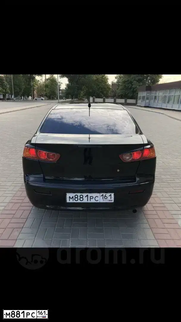Фото автомобиля MITSUBISHI LANCER, 2008 — госномер Н673НО15. Цвет: ЧЕРНЫЙ