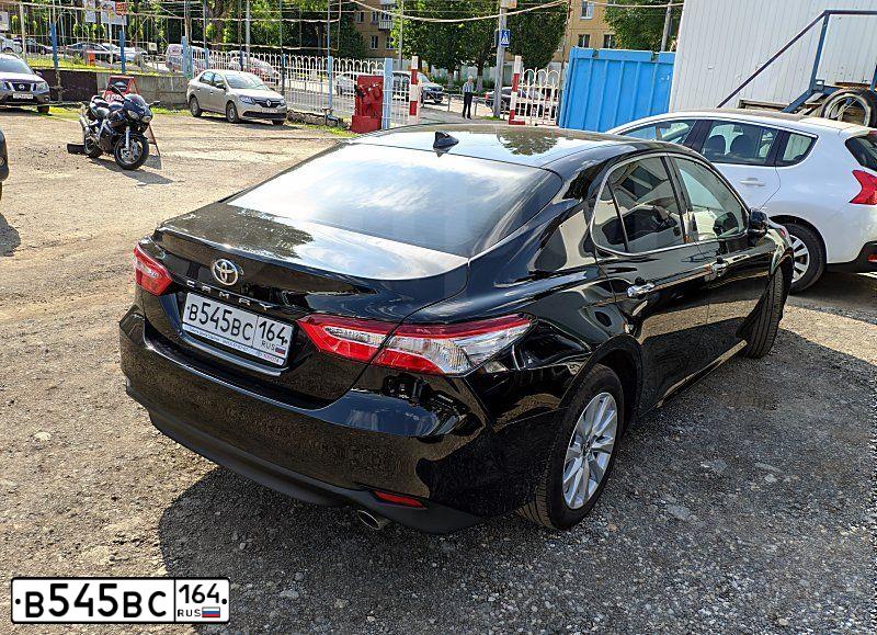 Фото автомобиля TOYOTA CAMRY, 2018 — госномер В067ЕЕ136. Цвет: ЧЕРНЫЙ МЕТАЛЛИК