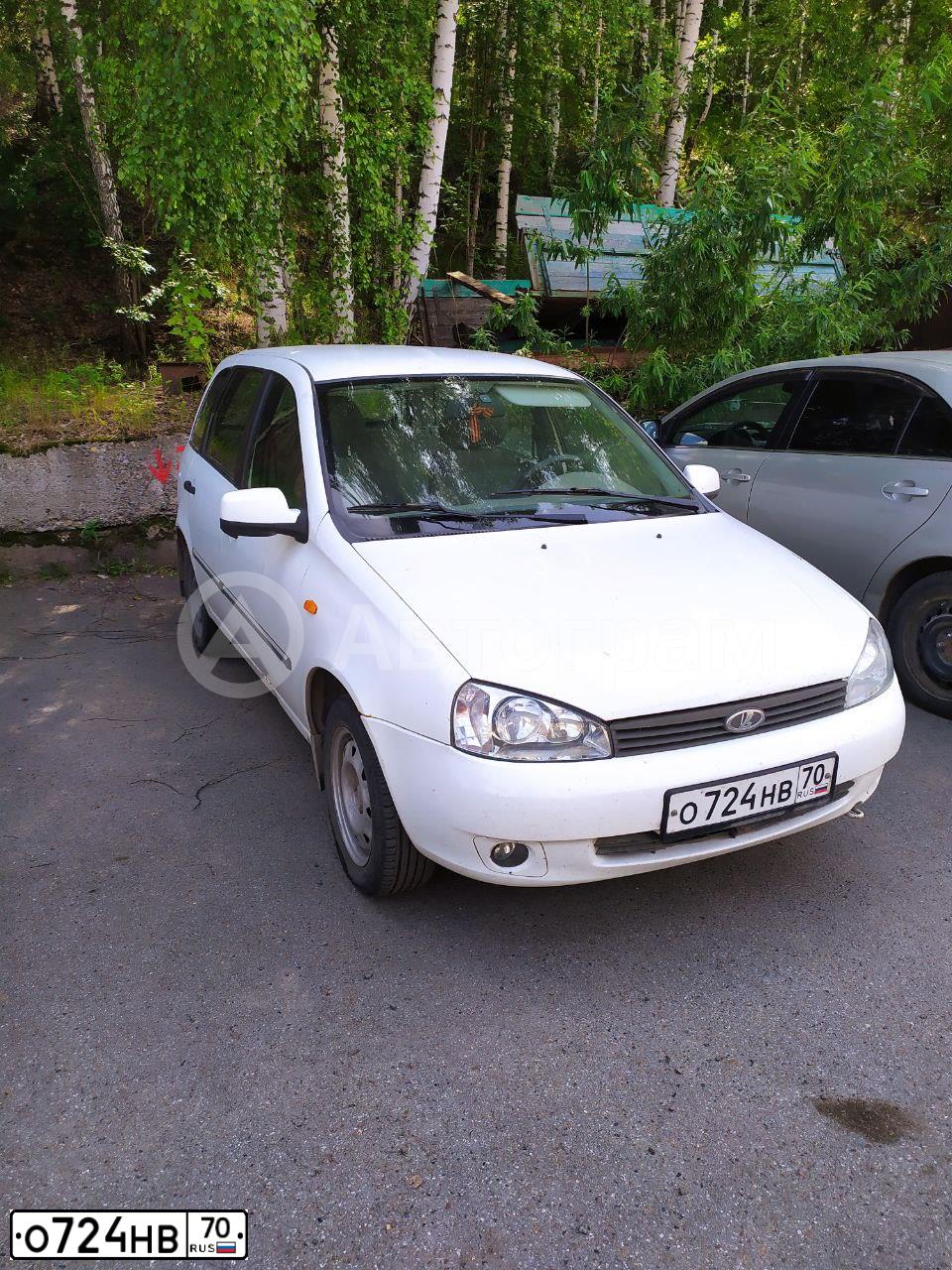 Фото автомобиля LADA 1117 KALINA, 2010 — госномер О724НВ70. Цвет: БЕЛЫЙ