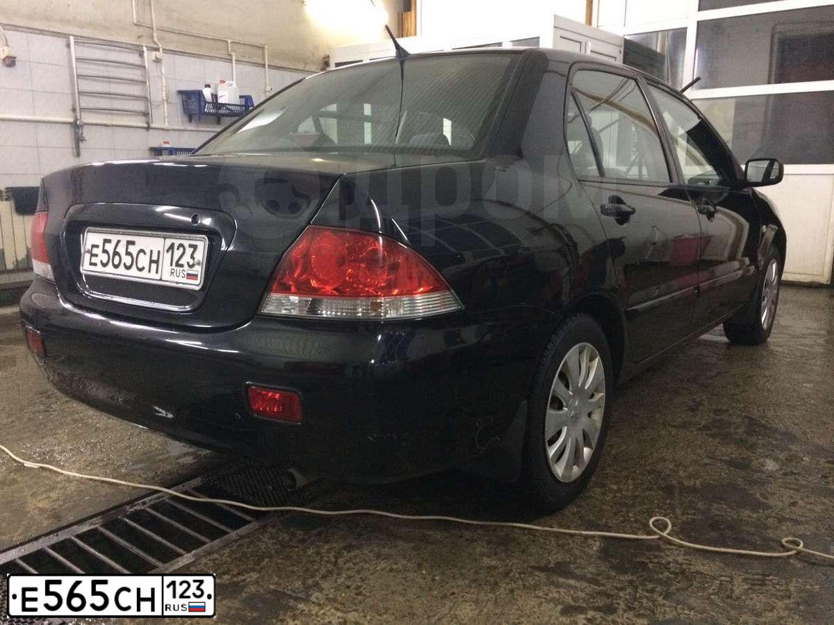 Фото автомобиля MITSUBISHI LANCER, 2005 — госномер Е565СН123. Цвет: ЧЕРНЫЙ