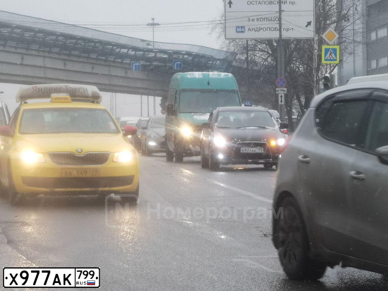 Фото автомобиля MITSUBISHI LANCER, 2012 — госномер Х977АК799. Цвет: ЧЕРНЫЙ
