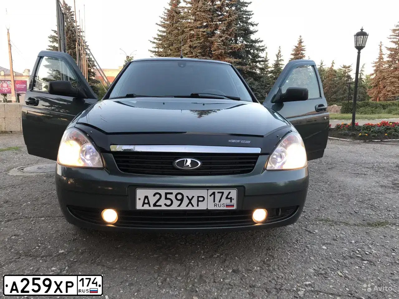 Фото автомобиля LADA 2172 PRIORA, 2011 — госномер М600АМ174. Цвет: СЕРО-ЗЕЛЕНЫЙ