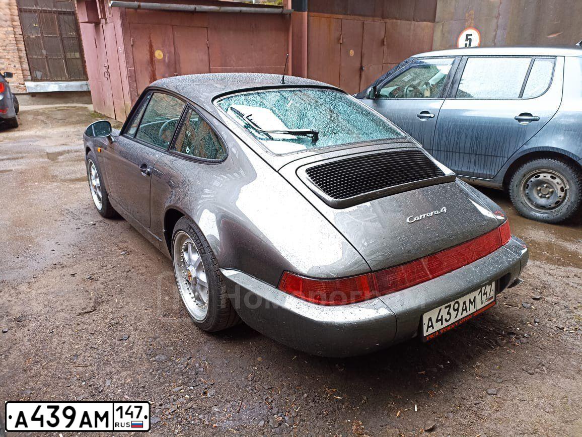 Фото автомобиля PORSCHE 911, 1991 — госномер К143УО797. Цвет: СЕРЫЙ