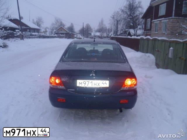Фото автомобиля MITSUBISHI LANCER, 2006 — госномер А115АВ252. Цвет: синий