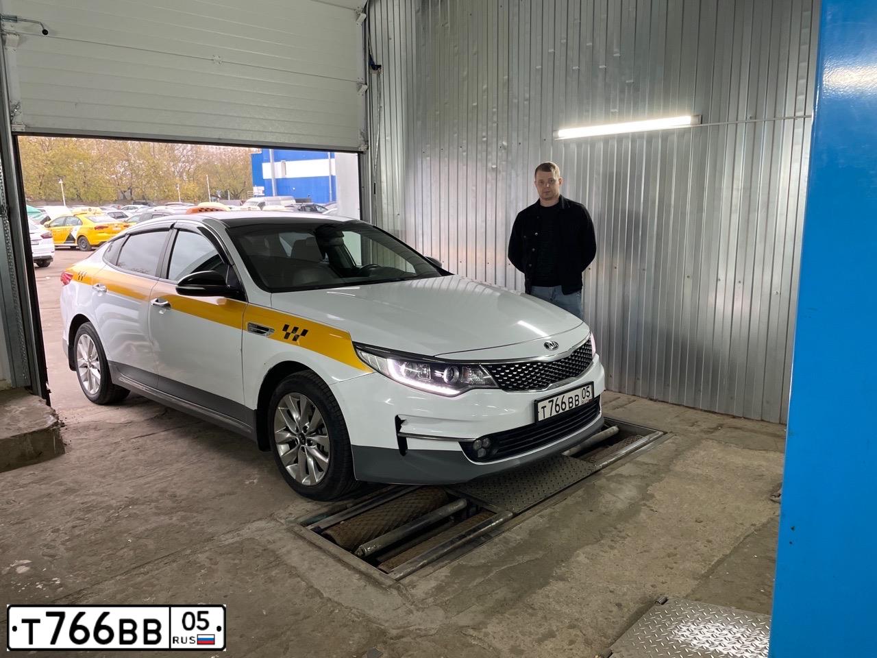 Фото автомобиля KIA MAGENTIS  OPTIMA, 2018 — госномер Т766ВВ05. Цвет: БЕЛЫЙ-ЖЕЛТЫЙ-СЕРЫЙ