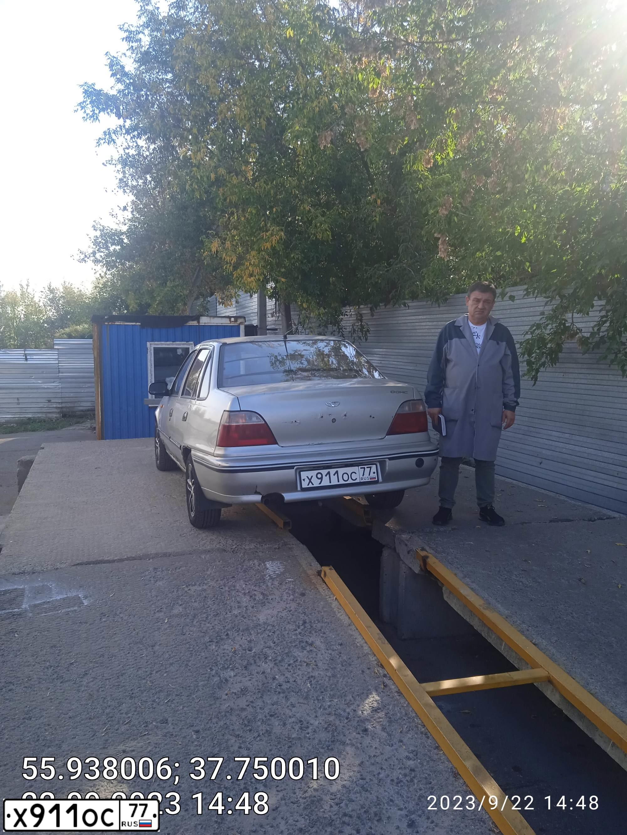 Фото автомобиля DAEWOO NEXIA, 2007 — госномер Х911ОС77. Цвет: СЕРЫЙ