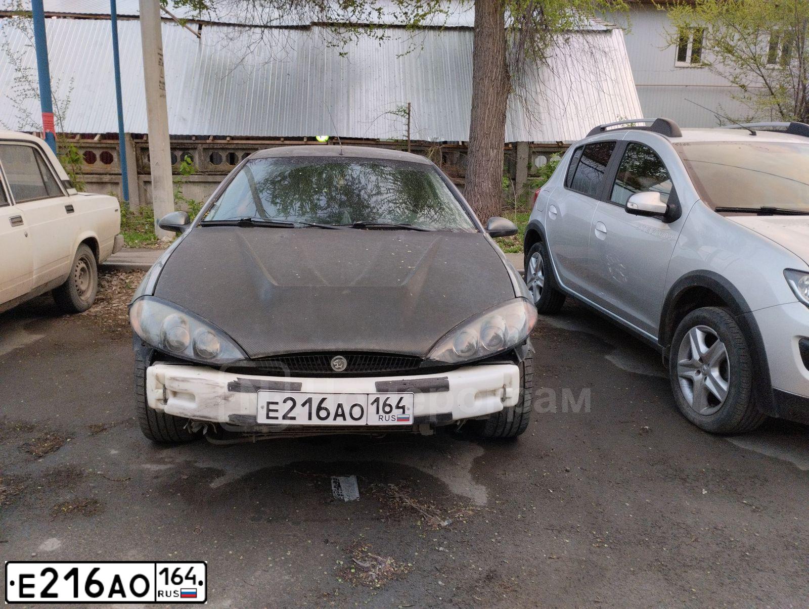 Фото автомобиля MERCURY COUGAR, 2000 — госномер К638ЕО32. Цвет: СЕРО-ЗЕЛЕНЫЙ