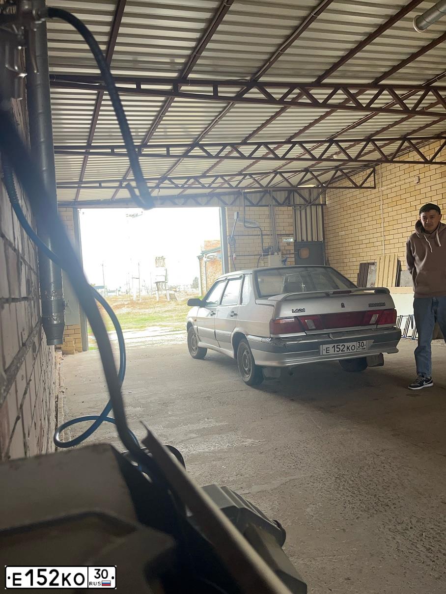 Фото автомобиля LADA 2115 SAMARA, 2007 — госномер Е152КО30. Цвет: Серебристый