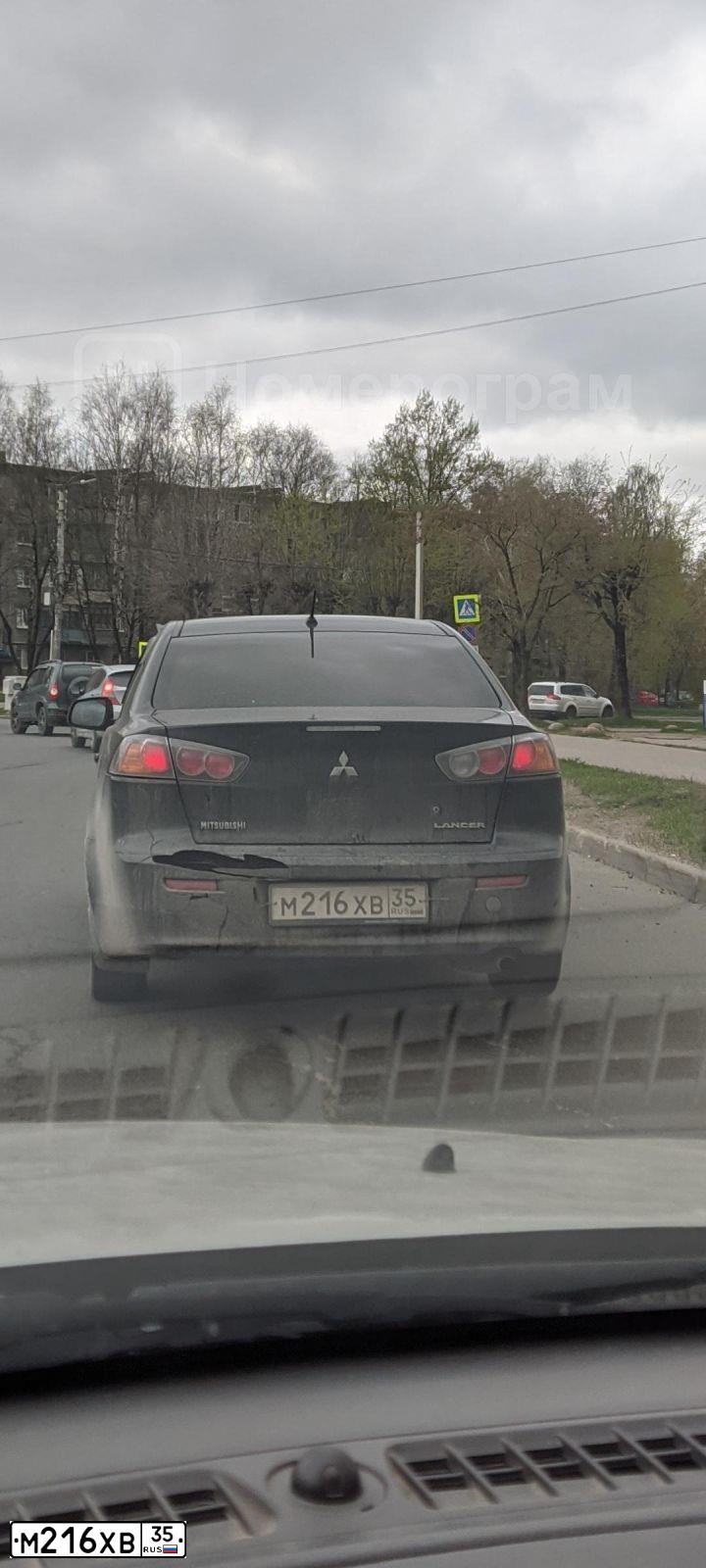 Фото автомобиля MITSUBISHI LANCER, 2012 — госномер М216ХВ35. Цвет: ЧЕРНЫЙ