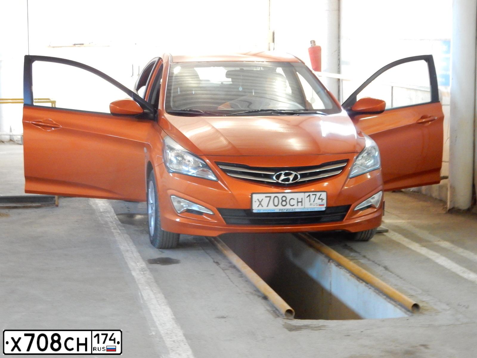 Фото автомобиля HYUNDAI SOLARIS, 2015 — госномер Х708СН174. Цвет: Оранжевый