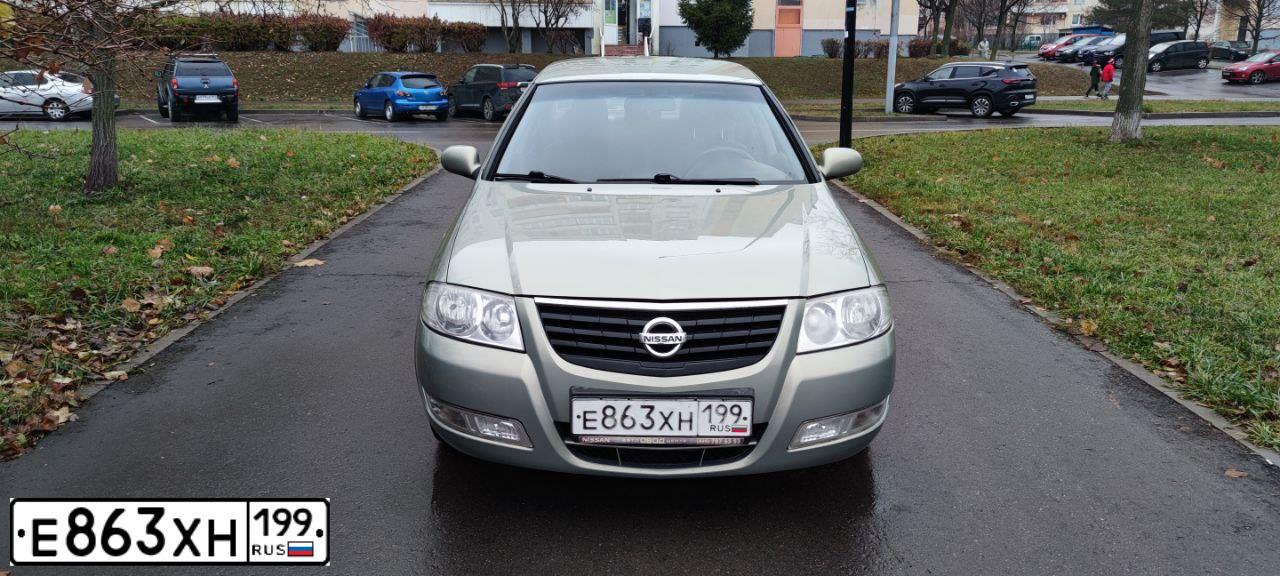 Фото автомобиля NISSAN ALMERA, 2010 — госномер Е863ХН199. Цвет: СЕРО-ЗЕЛЕНЫЙ