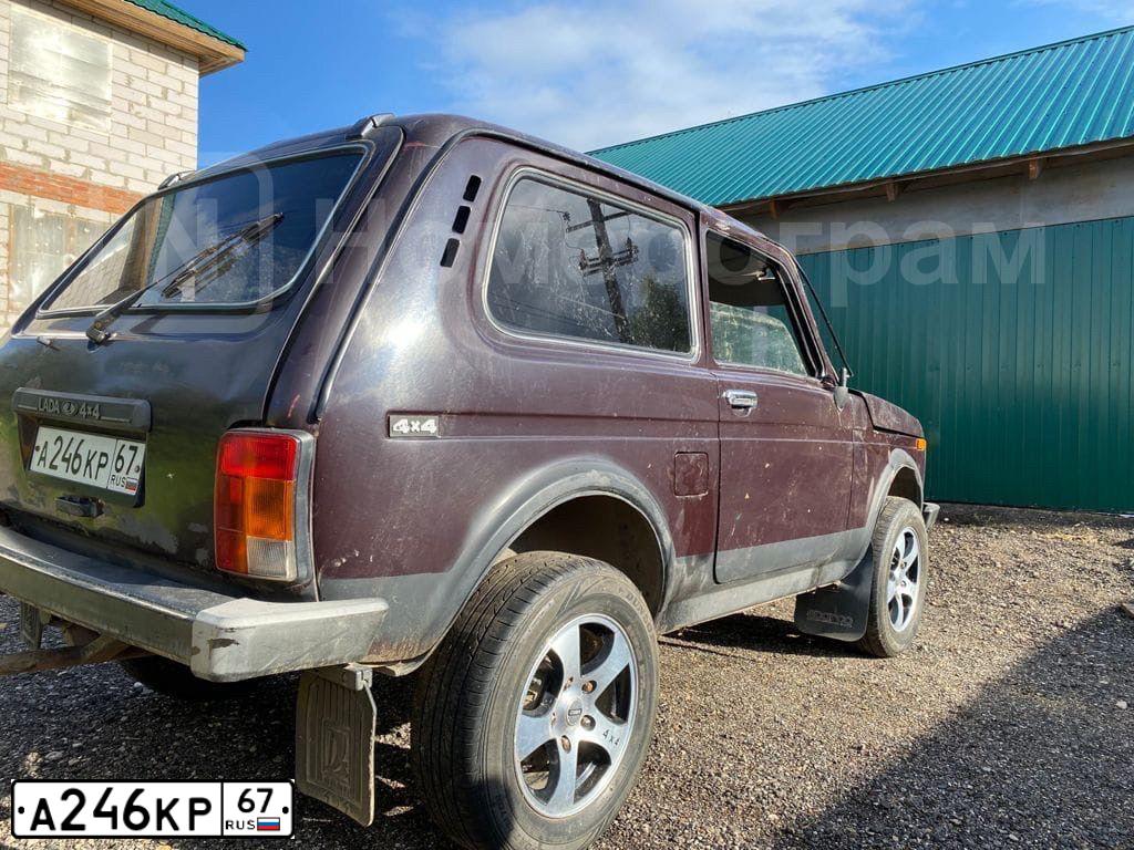 Фото автомобиля LADA 2121 NIVA, 2008 — госномер Р365НТ67. Цвет: ТЕМНО-КОРИЧНЕВЫЙ