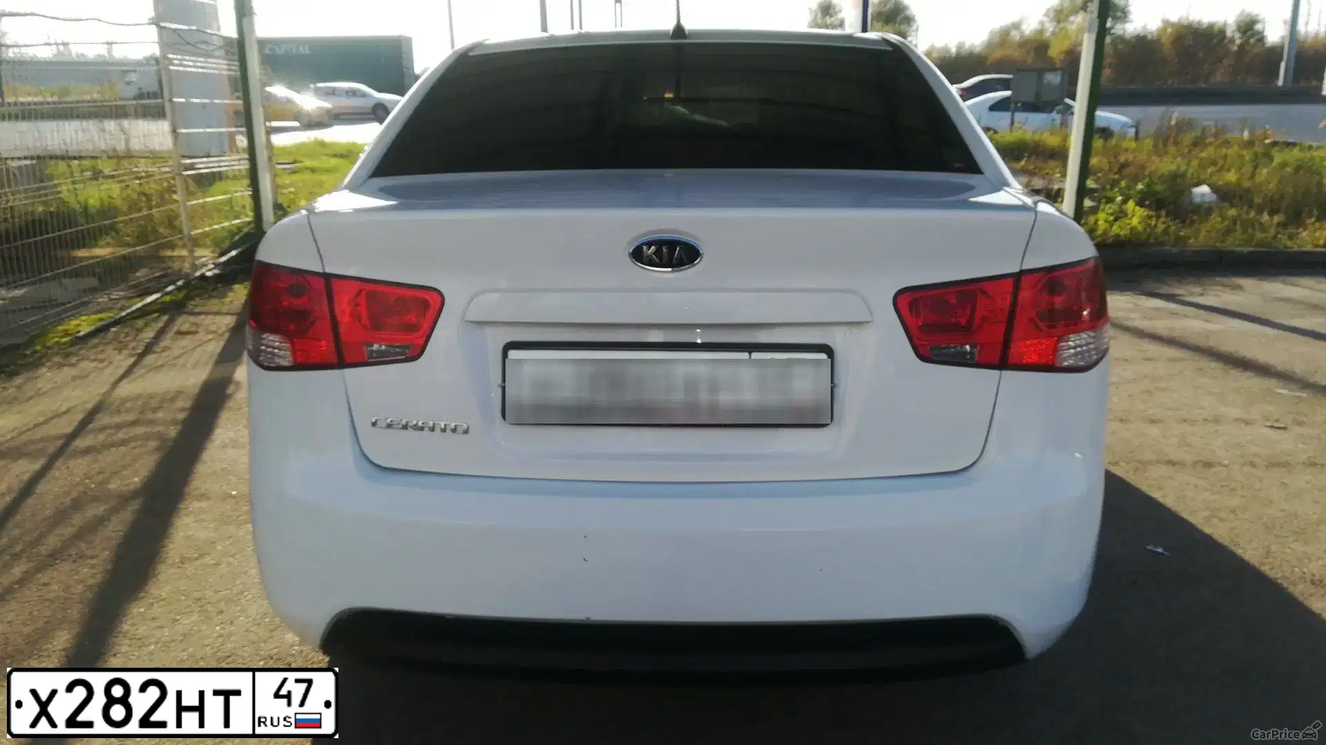 Фото автомобиля KIA CERATO, 2010 — госномер К215ОР53. Цвет: Белый