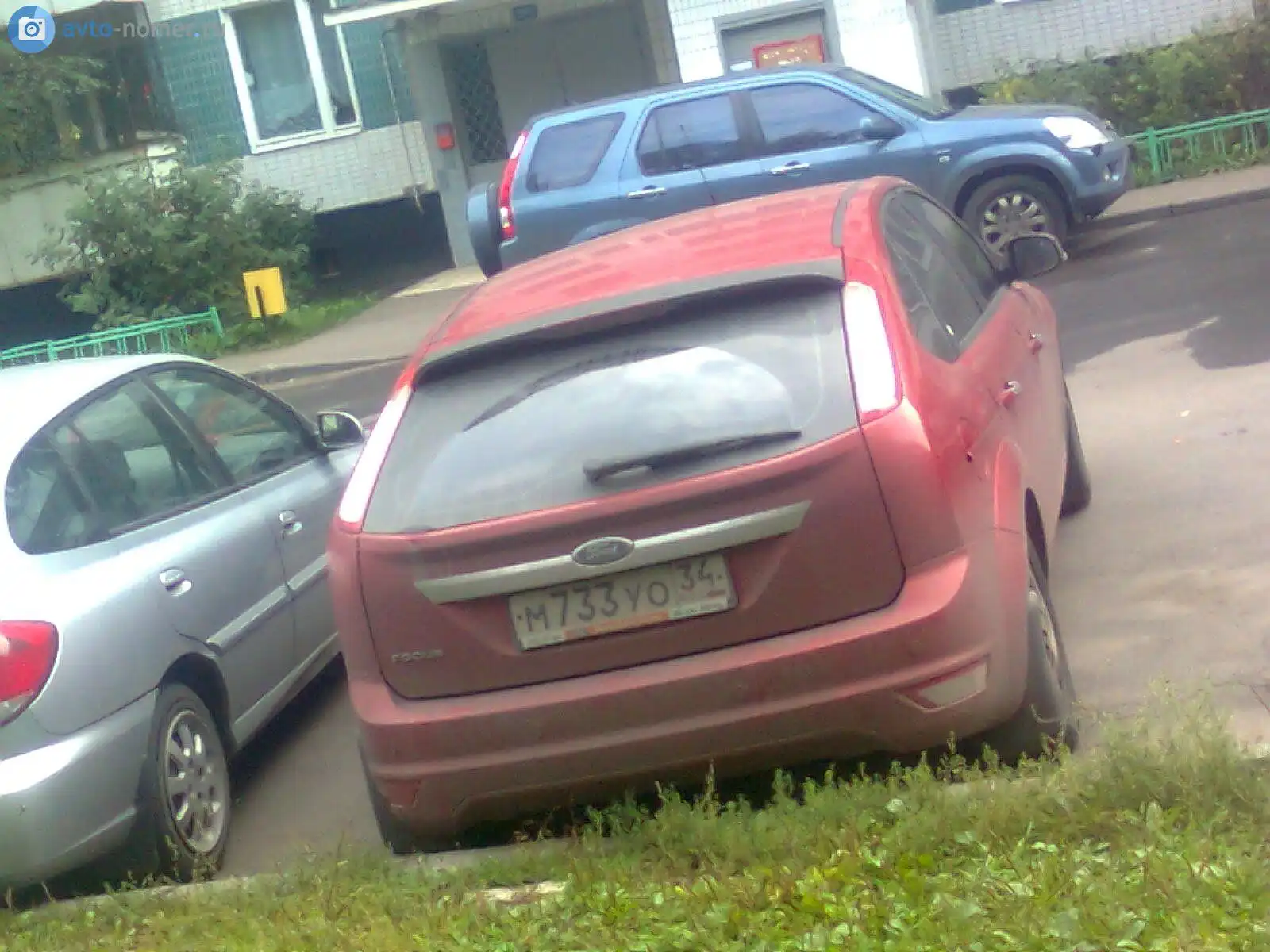 Фото автомобиля FORD FOCUS, 2008 — госномер М733УО34. Цвет: Красный